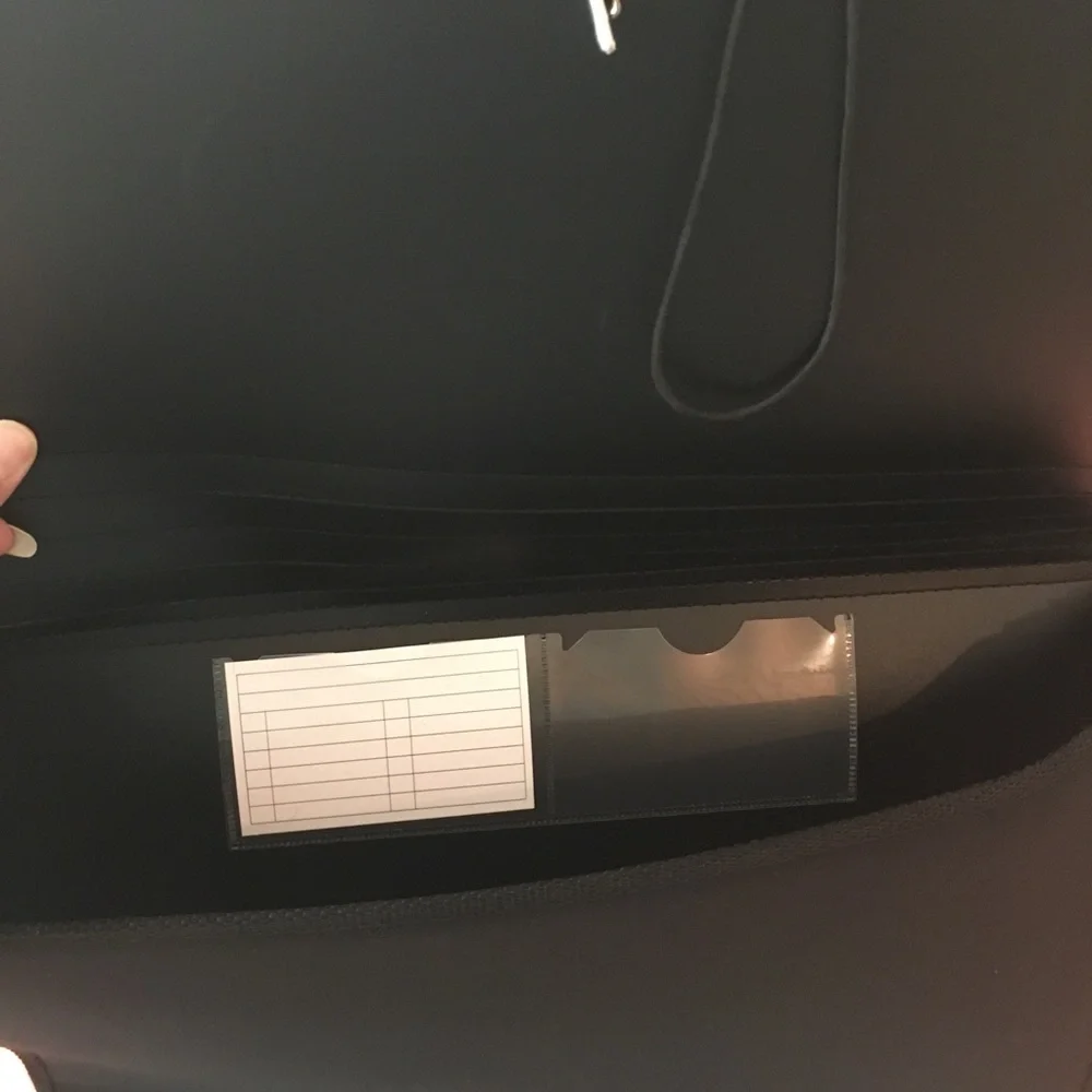 Portfolio legal size in black material. NWOT